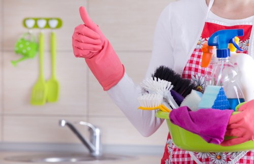 Trained carpet cleaner using protective gloves during a cleaning task